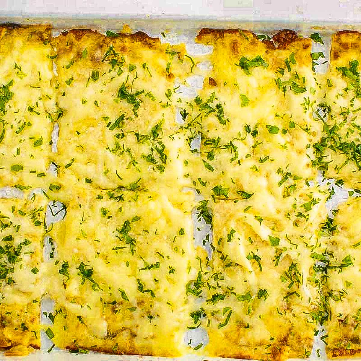 Keto breadsticks made with cheese and zucchini.