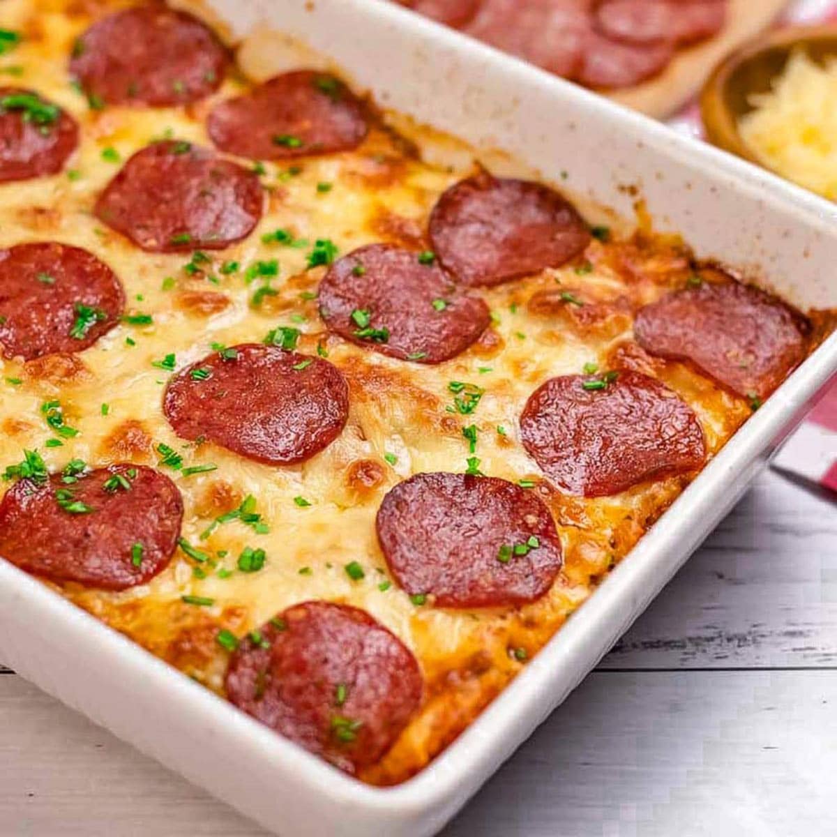 Keto pizza casserole in a baking dish.