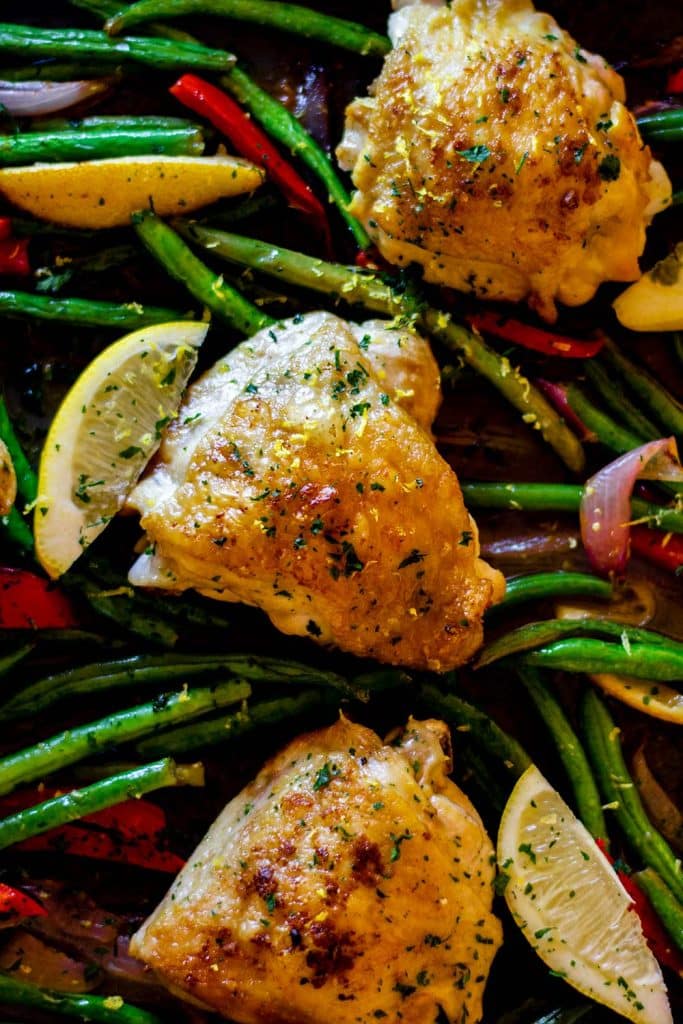 Keto lemon chicken thighs on a sheet pan.