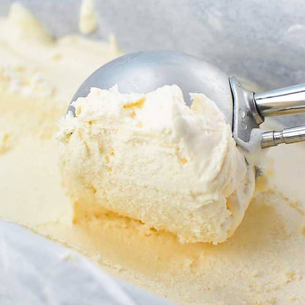 Keto no churn ice cream being scooped with an ice cream scoop.