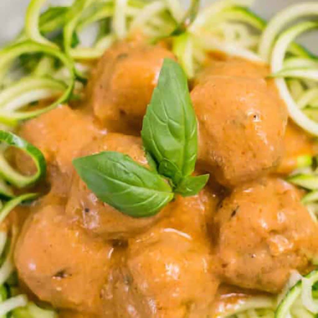 Keto Italian meatballs served with zoodles in a bowl.