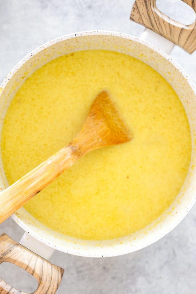 Chicken laksa being made in a pot.