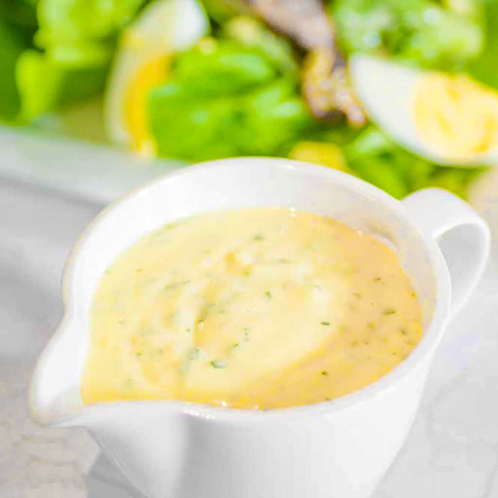 Keto Caesar salad dressing in a pouring jug.