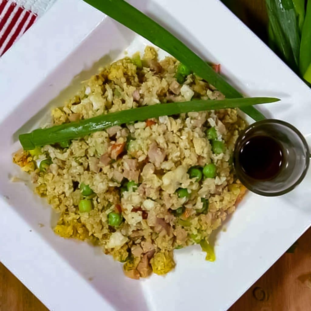 Keto fried rice on a white plate.