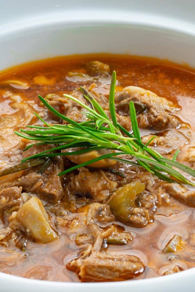 Keto lamb stew in a white bowl.