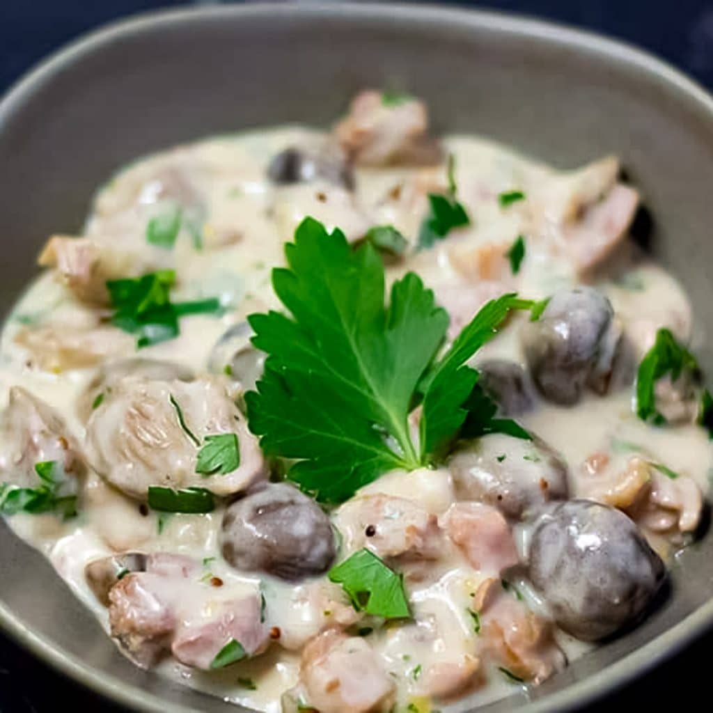 Keto turkey stew in a grey bowl.