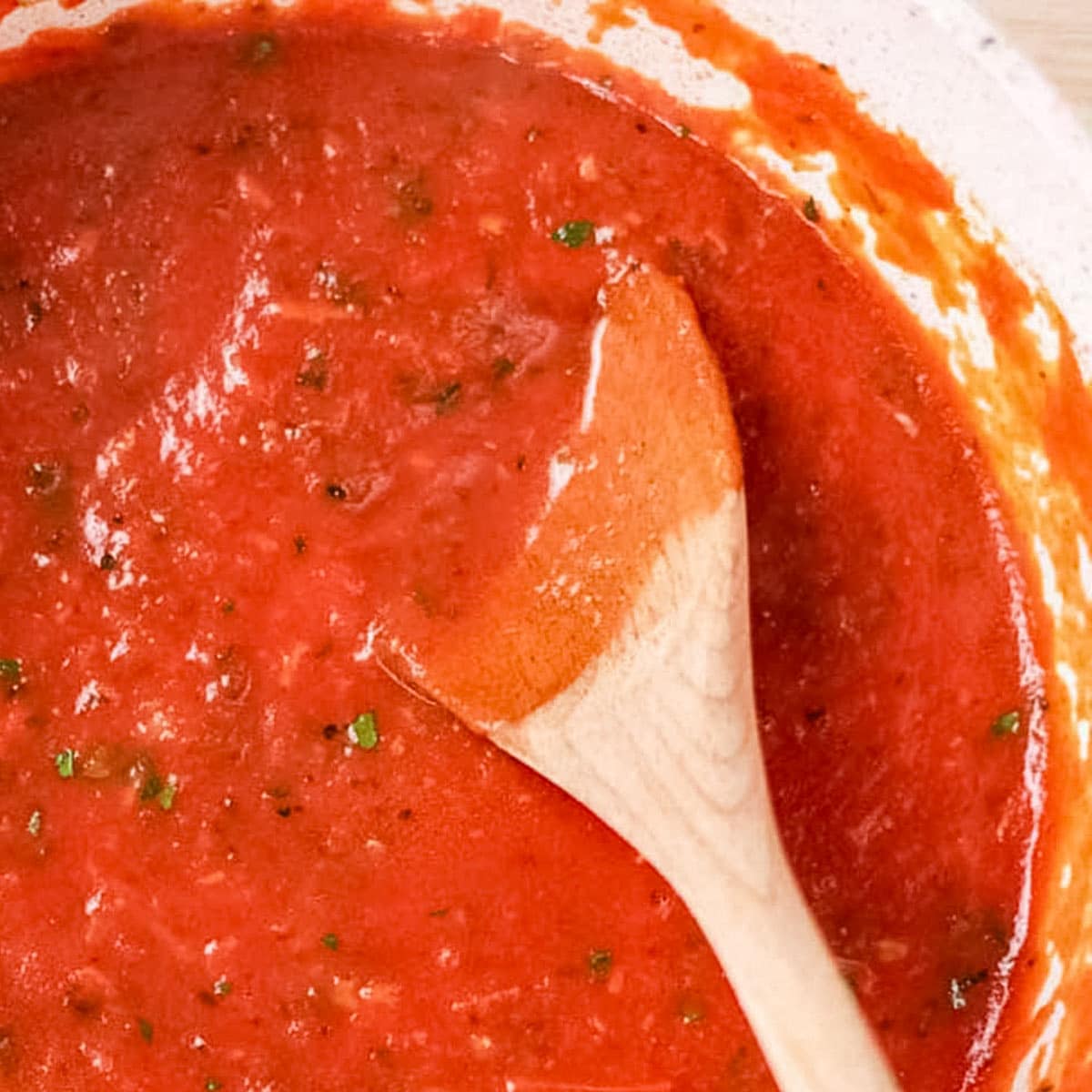 Keto pizza sauce in a saucepan.