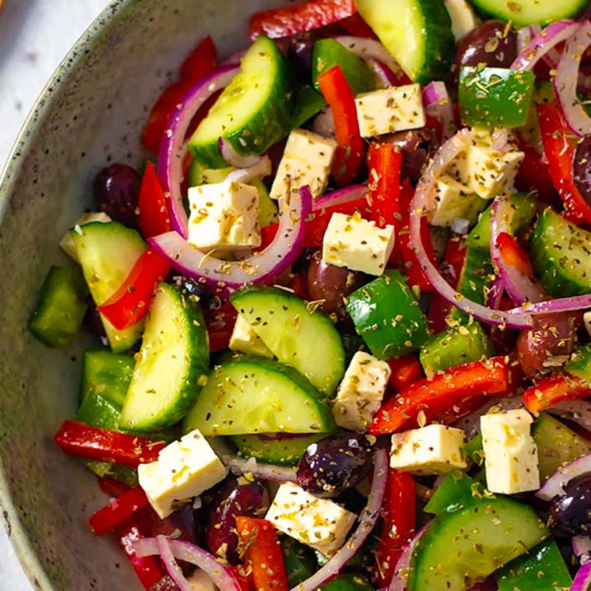 Keto Greek salad in a grey bowl.