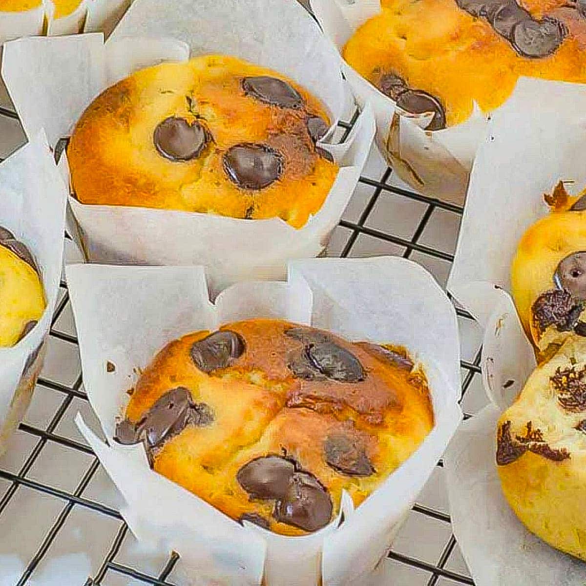 Keto chocolate chip muffins on a cooling rack.