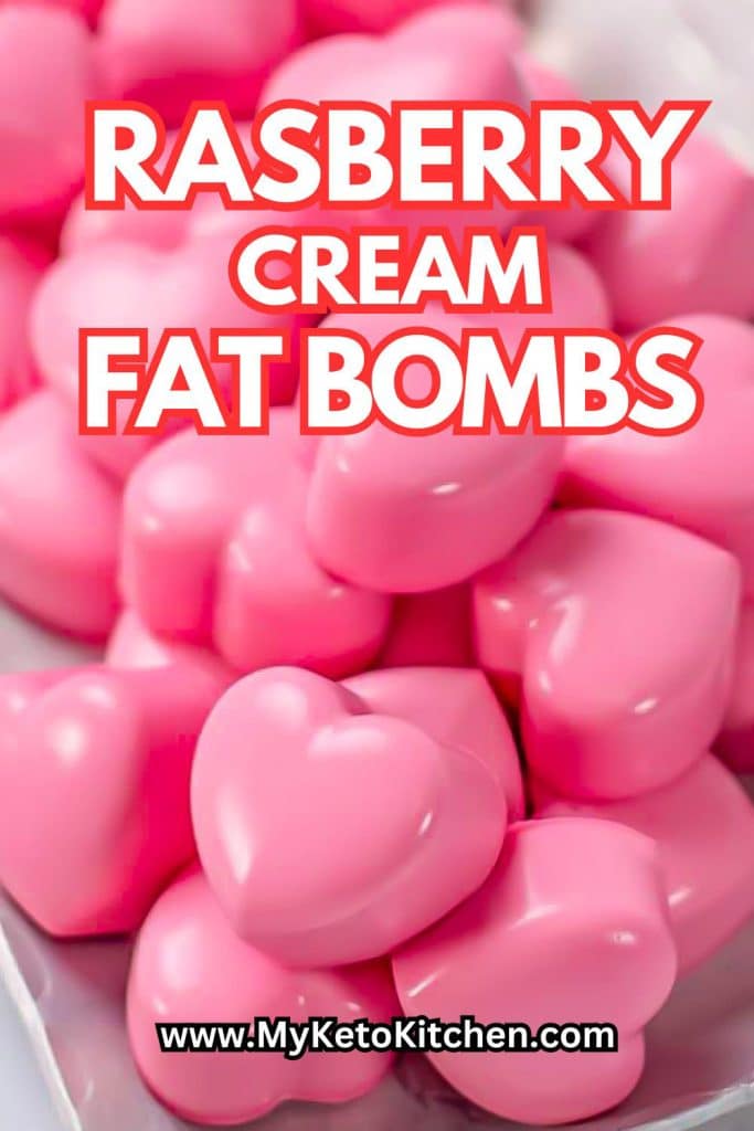 Keto raspberry cream fat bombs on a silver plate.