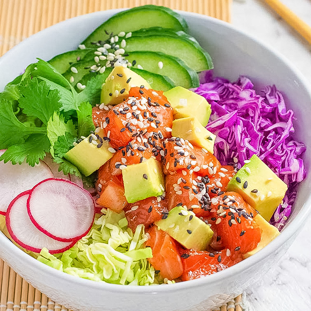 Keto poke salad in a white bowl.