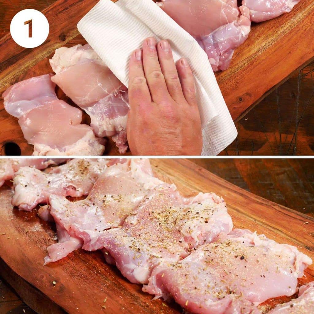 Seasoning chickne thighs on a wooden chopping board.