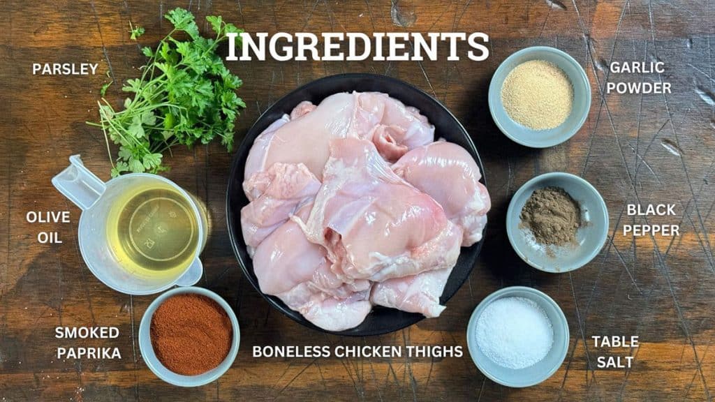 Grilled chicken thighs ingredients. Boneless chicken thighs, paprika, salt, pepper, garlic powder, olive oil and parsley.
